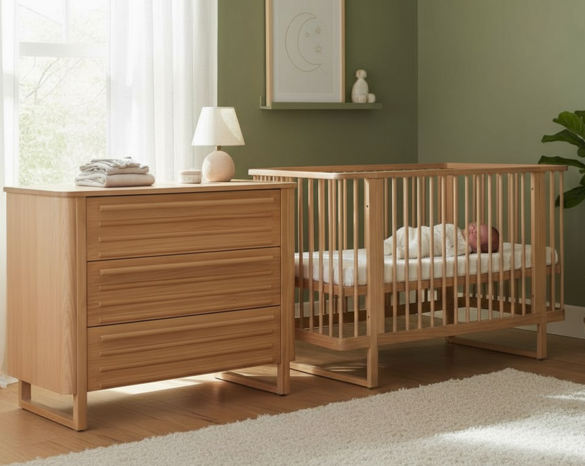 Rever Bebe Agra Sandstone cot with rounded slats beside its matching three-drawer chest.