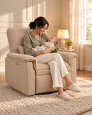 AI-staged lifestyle image of a mum cradling her baby in the Rever Bebe Ollie Coffee nursery chair