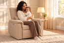 AI-staged lifestyle image of a mum cuddling her baby beside a window in the Rever Bebe Ollie Coffee nursery chair