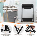 Folding baby change table in black with storage basket and shelf, designed for easy diaper changes and convenient.