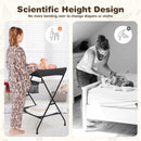 Folding baby change table in black with storage basket, designed for comfortable diaper changes without bending.