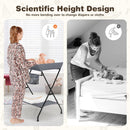 Folding baby change table in grey with storage basket, designed for comfortable diaper changes without bending.