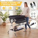 Baby changing table in black with storage bag, adjustable height, and 4 lockable wheels for easy mobility and.