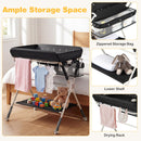 Baby changing table in black with zippered storage bag, lower shelf, and drying rack for convenient baby care.