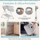 Baby changing table in grey with storage bag and shelf, foldable for easy transport and storage, ideal for newborns.