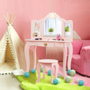 Kids vanity table and chair set in pink with tri-folding mirror and drawer, perfect for girls' room decor and play.