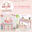 Kids pink vanity table set with 360° rotating mirror, detachable top for dual use as writing desk, and storage drawers.