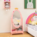 Pink kids freestanding dressing mirror with 360° rotatable design, storage shelf, and crown detail for a stylish room.