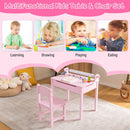Kids pink table and chair set with storage and paper roll holder, perfect for drawing, studying, and playing activities.