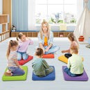 Red square floor cushion with carrying handle, offering comfortable seating for kids, made from waterproof PU for easy.