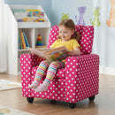 Toddler sofa in pink polka dots with adjustable backrest, cup holder, and soft velvet fabric for comfortable seating.