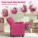Kids recliner in pink polka dot velvet with adjustable backrest and footrest, perfect for reading and relaxing.