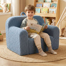 Toddler foam couch in blue with teddy fleece cover, perfect for reading and playtime in a cozy playroom setting.