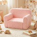 Toddler foam couch in pink with teddy fleece cover, ideal for playroom relaxation and easy for kids to move around.