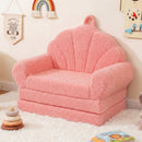 Pink 2-in-1 kids flip-out sofa with plush teddy fleece cover, shell-shaped backrest, perfect for playroom relaxation.