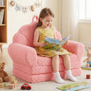 Plush pink 2-in-1 kids flip out sofa with teddy fleece cover, perfect for reading and relaxing in playrooms.