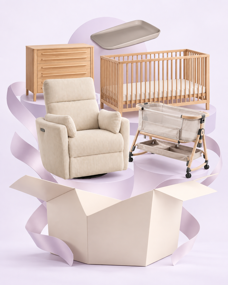 Rever Bebe cot, chest, Milano nursery chair, bassinet and deluxe change mat arranged above a gift box.