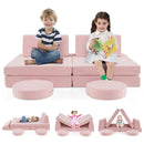 Two children sitting on a pink modular kids play couch set, showcasing the versatile arrangement and soft velvet fabric.