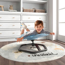 Child enjoying the Petal Sensory Swivel Chair in blue, promoting sensory development and safe spinning fun indoors.