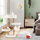 Wooden cat tree with jute scratching posts, 5 tiers, and cozy hammock for playful kittens in a stylish living room.