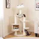 Multi-level 132 cm tall wooden cat tree with condo, plush perch, and scratching posts for playful cats in a cozy home.