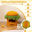 Hamburger-shaped cat bed cave in orange with removable cushion and hanging chicken drumstick toy for cozy pet.
