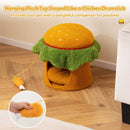 Hamburger-shaped cat condo with removable cushion and hanging chicken drumstick toy for cozy playtime and relaxation.