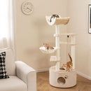 Tall wooden cat tree with condo and plush cushions, featuring multiple levels and interactive scratching posts for.