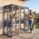 Large outdoor cat house in grey with weatherproof asphalt roof, featuring 7 platforms and 2 condos for playful cats.