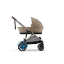 Almond Beige e-Gazelle S frame fitted with an optional Gazelle S carry cot. Carry cot sold separately; the standard pram includes one seat.