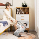 Grey baby bouncer in a nursery with adult supervision