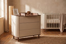 Kenva Chest — with the Kenva Cot in a nursery, close view