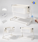 Ivory Kidilo KB508 electric bedside bassinet showing mesh sides, lowering front panel, wheels and included accessories