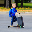 Kid riding a blue and white 2-in-1 skateboard luggage with lighted wheels, perfect for outdoor adventures and travel.