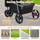 Close-up of the smooth-rolling wheels of a black pet stroller, featuring a one-foot safety brake for secure mobility.