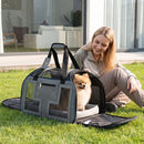 Side view of the grey rolling pet carrier showcasing mesh windows, a soft padded cushion, and a detachable shoulder strap.