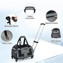 Rolling pet carrier in grey features a padded carry handle, removable wheels, and breathable mesh for pet comfort.