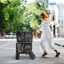 4-in-1 double pet stroller in black with detachable carriers, perfect for walking and traveling with cats.