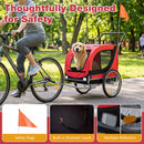 Dog bike trailer in red with breathable mesh windows, safety flag, and reflectors for secure pet transport.