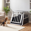 Compact trapezoidal aluminum dog crate with lockable door, designed for secure pet transport in vehicles.