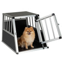 Travel dog crate with lockable door, made of chew-resistant aluminum, designed for secure pet transport in vehicles.