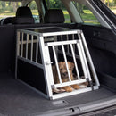 Travel dog crate with aluminum frame and lockable door, designed for secure pet transport in vehicles.