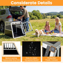Travel dog crate with trapezoidal design, aluminum frame, and lockable door for secure pet transport in vehicles.