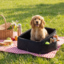 Cozy black dog car seat for small to medium pets, featuring soft fabric and side storage pockets for travel convenience.