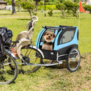 Folding pet bike trailer in blue with mesh windows, carrying a small dog, ideal for outdoor adventures and safety.
