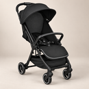 Rever Bebe Joy stroller in Black, three-quarter view on a light taupe studio background