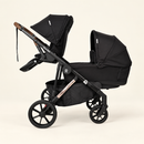 Rever Bebe VEVO Black single-to-double pram shown with one seat and one bassinet on a cream background