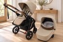 Rever Bebe VEVO Taupe pram with a separate matching bassinet in a softly lit home