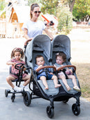 VeeBee Co-Rider Black attached beside a double stroller; stroller not included